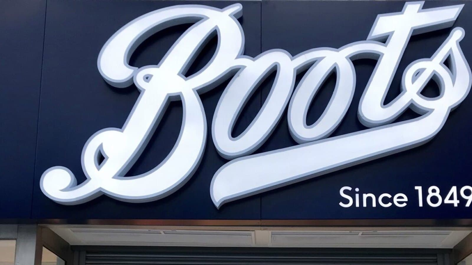 The Boots pharmacy storefront sign reading "Boots, Since 1849" above a shop entrance.