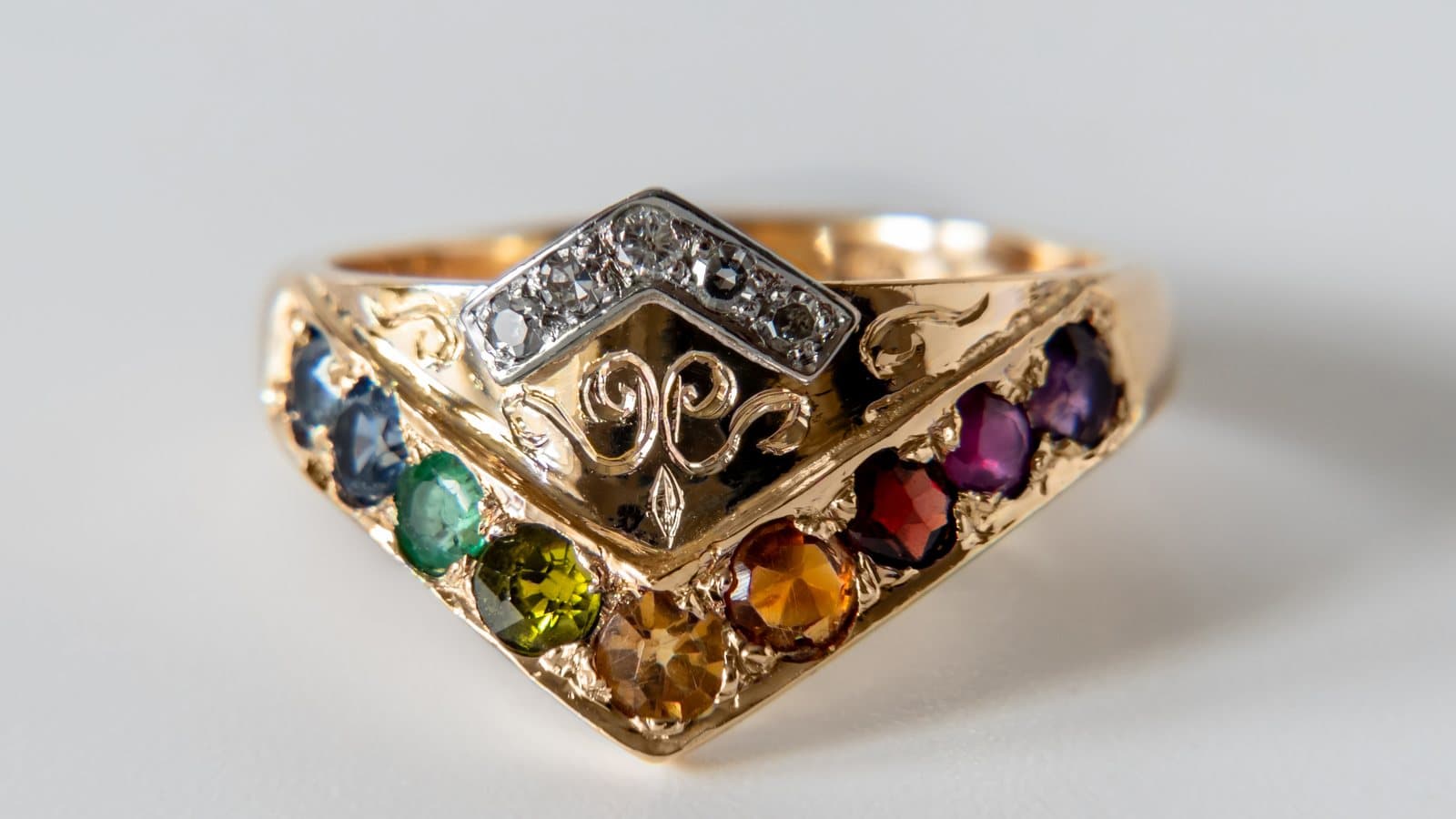 Gold ring with different gemstones set in a rainbow and topped with diamonds 1. File photograph.